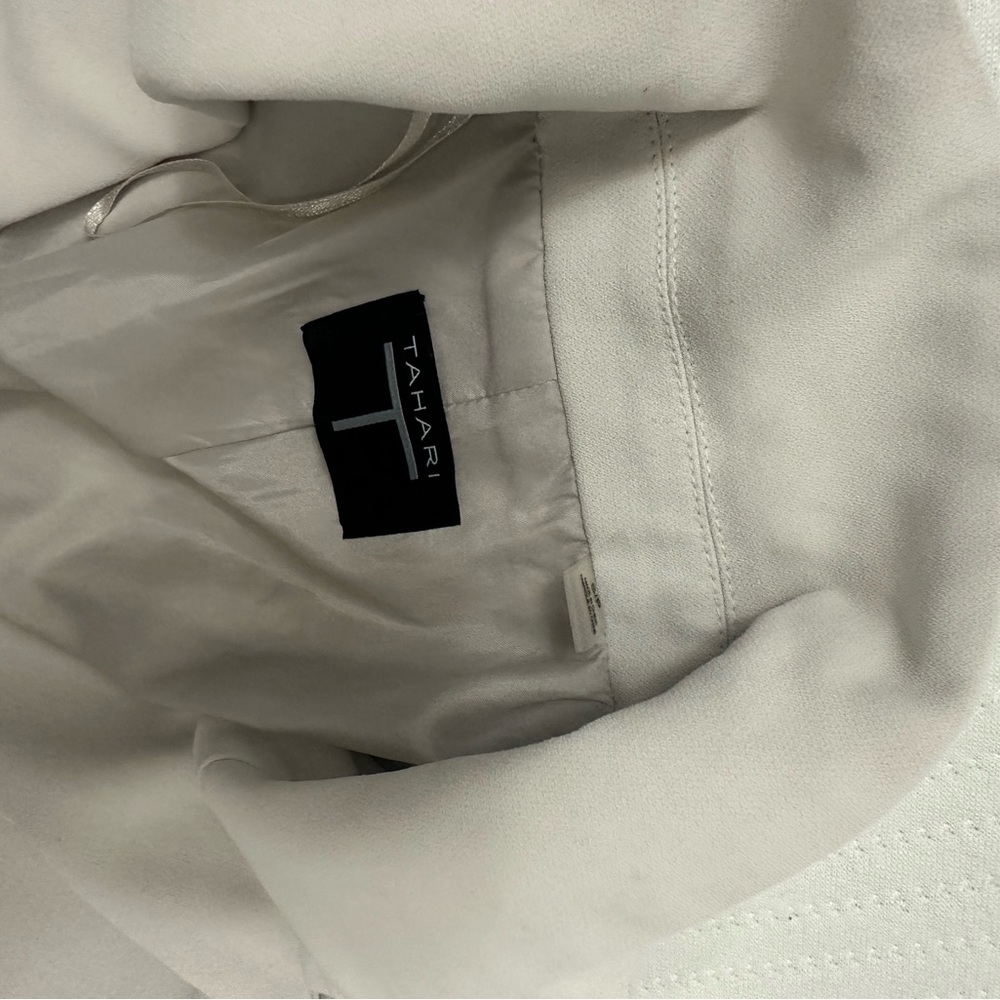 Suit light grey. Only worn once